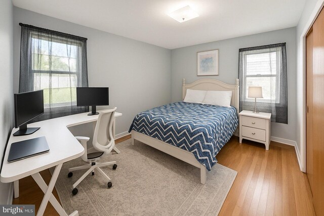 4422 Sharon Dr, Wilmington, DE 19808 - bedroom with light wood-type flooring and a desk