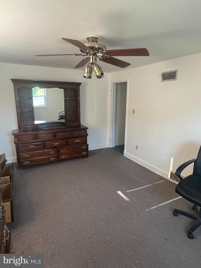 1969 Victory Dr, Baltimore, MD 21227 - unfurnished bedroom with carpet floors, a ceiling fan, and baseboards
