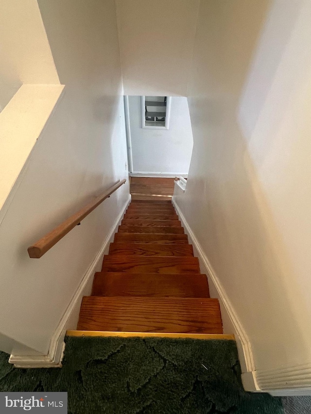 1969 Victory Dr, Baltimore, MD 21227 - staircase featuring baseboards