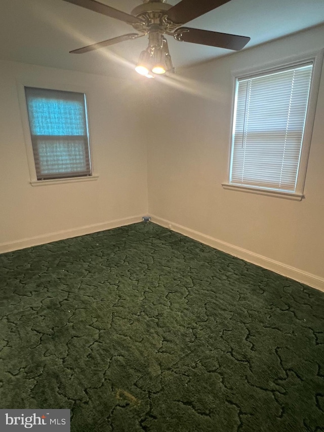 1969 Victory Dr, Baltimore, MD 21227 - carpeted empty room with a ceiling fan and baseboards
