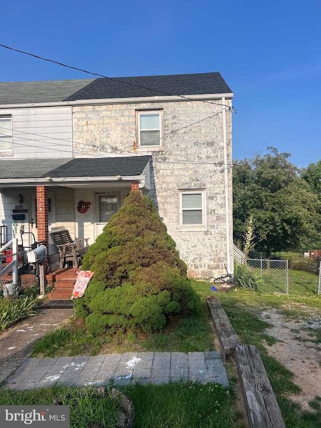 1969 Victory Dr, Baltimore, MD 21227 - view of property with covered porch and stone siding