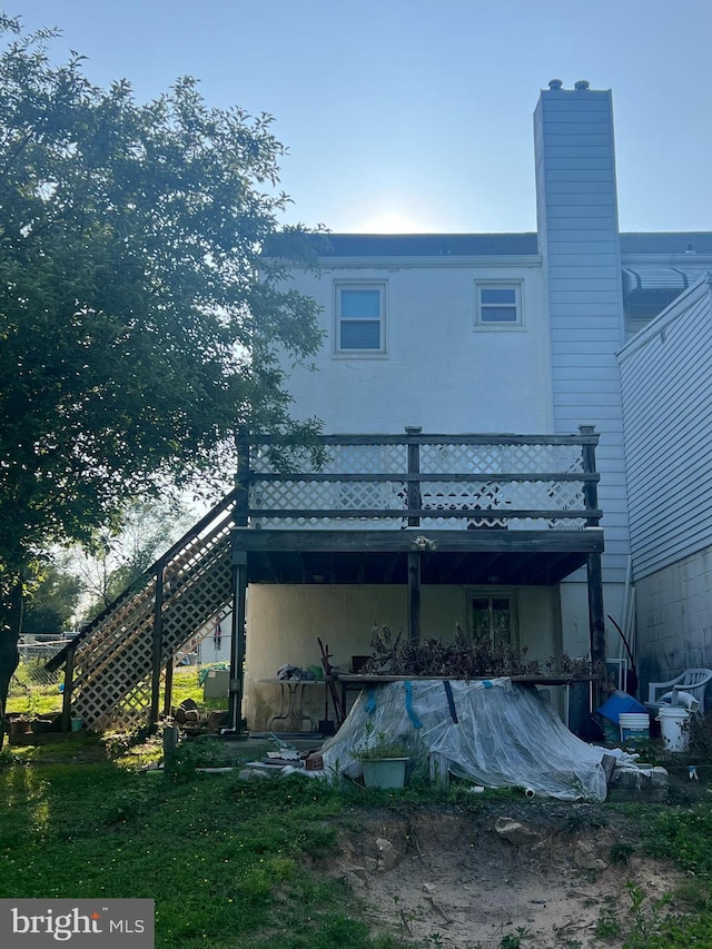 1969 Victory Dr, Baltimore, MD 21227 - back of property featuring stairs and a chimney