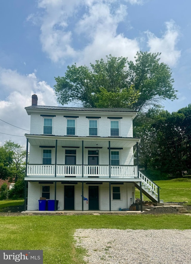 27 W Mark Ave, Windsor, PA 17366 - rear view of house with a chimney, stairway, and a lawn
