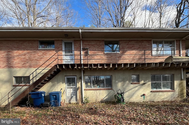 7230 Lackawanna, Springfield, VA 22150 - rear view of house with brick siding, stairs, and a balcony