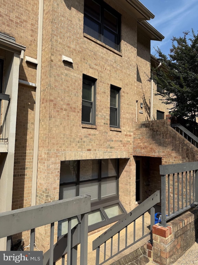 5147 Dudley Ln Unit 44, Bethesda, MD 20814 - rear view of house featuring brick siding