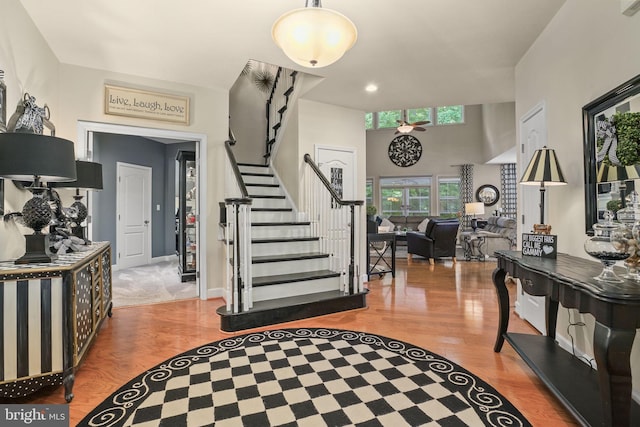 11742 Maid At Arms Ln, Berlin, MD 21811 - entryway featuring stairs, wood finished floors, and recessed lighting