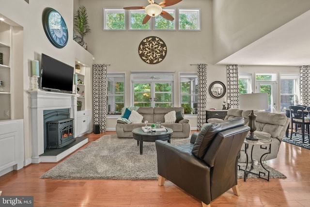 11742 Maid At Arms Ln, Berlin, MD 21811 - living room with ceiling fan, a high ceiling, french doors, plenty of natural light, and wood finished floors