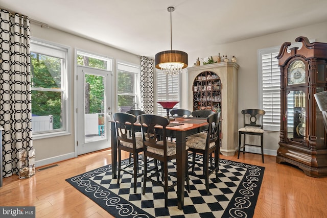 11742 Maid At Arms Ln, Berlin, MD 21811 - dining space with healthy amount of natural light, baseboards, and wood finished floors
