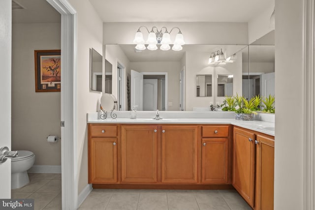 11742 Maid At Arms Ln, Berlin, MD 21811 - bathroom featuring vanity, toilet, tile patterned flooring, a chandelier, and baseboards