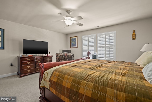 11742 Maid At Arms Ln, Berlin, MD 21811 - bedroom with light carpet, baseboards, and a ceiling fan