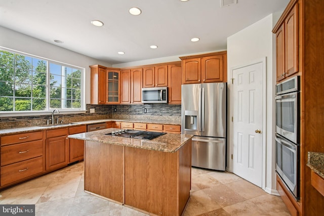 1624 Osprey Cir, Cambridge, MD 21613 - kitchen featuring appliances with stainless steel finishes, stone counters, recessed lighting, glass insert cabinets, and tasteful backsplash