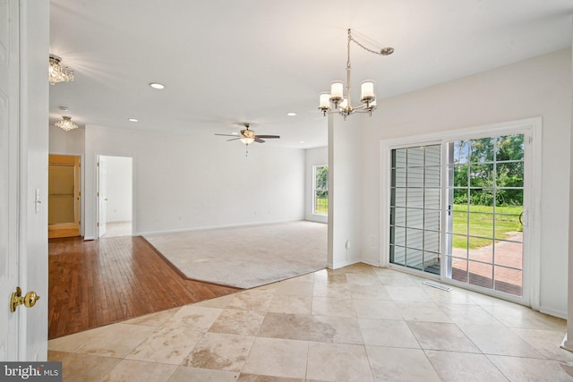 1624 Osprey Cir, Cambridge, MD 21613 - unfurnished room with a chandelier, ceiling fan, recessed lighting, and light tile patterned floors