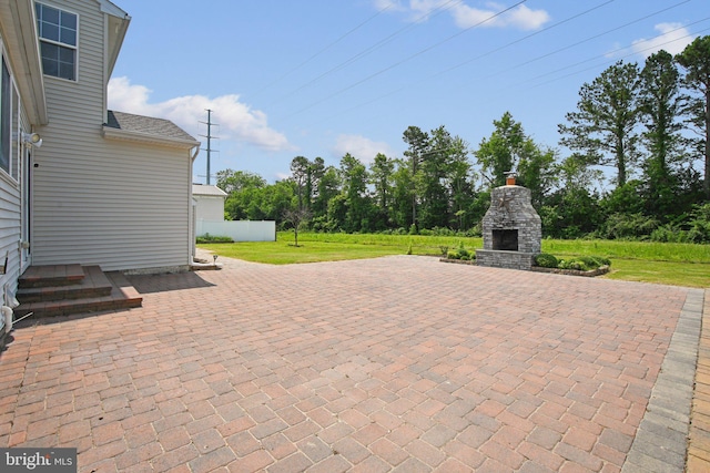 1624 Osprey Cir, Cambridge, MD 21613 - view of patio / terrace with an outdoor stone fireplace