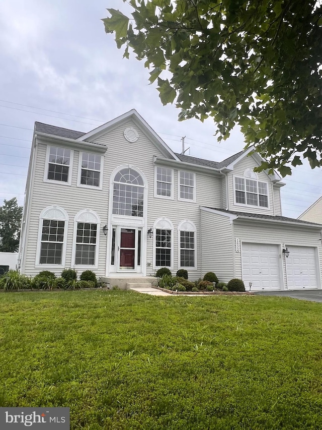 1624 Osprey Cir, Cambridge, MD 21613 - view of front of property featuring a front lawn, driveway, and an attached garage