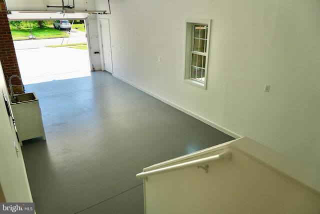 8408 Conover Pl, Alexandria, VA 22308 - garage with a sink and baseboards