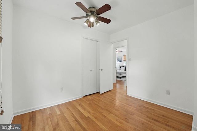 8408 Conover Pl, Alexandria, VA 22308 - unfurnished bedroom featuring light wood-style floors, a closet, and a ceiling fan