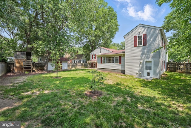 8408 Conover Pl, Alexandria, VA 22308 - rear view of property with a fenced backyard and a storage unit