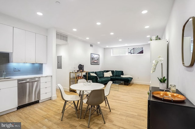 3514 13th St NW Unit 1, Washington, DC 20010 - dining space with electric panel, recessed lighting, light wood-style floors, and baseboards