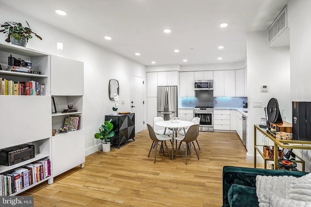 3514 13th St NW Unit 1, Washington, DC 20010 - dining room with light wood-style flooring and recessed lighting