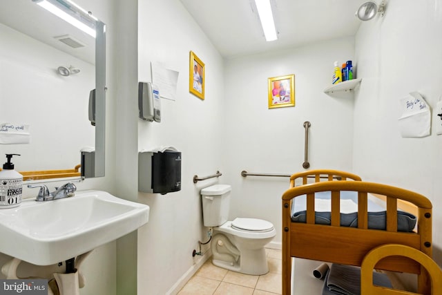 7221 W Passyunk Ave, Philadelphia, PA 19142 - bathroom with tile patterned flooring, toilet, baseboards, and a sink