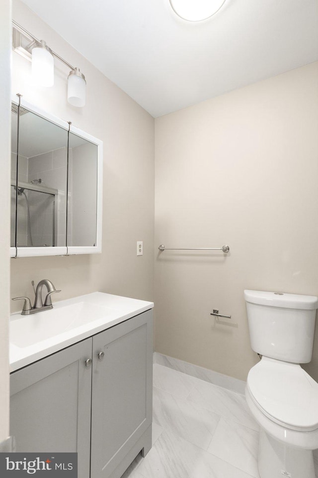 1003 Cedar Park Rd, Annapolis, MD 21401 - bathroom with vanity, marble finish floors, and a shower with shower door