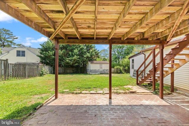 1003 Cedar Park Rd, Annapolis, MD 21401 - fenced backyard with a patio area, a shed, and stairway