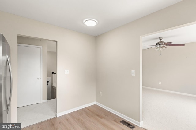 1003 Cedar Park Rd, Annapolis, MD 21401 - spare room with ceiling fan, light wood-style flooring, and light colored carpet