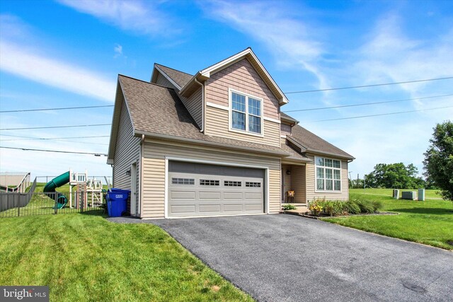 305 Old Stone Way, York, PA 17406 - traditional-style home with driveway, a front yard, an attached garage, roof with shingles, and a playground