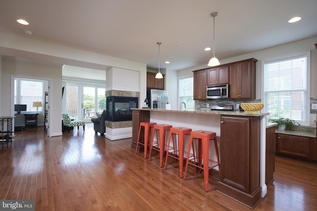 400 Blue Flax Pl, Gaithersburg, MD 20878 - kitchen with stainless steel appliances, dark wood-type flooring, tasteful backsplash, plenty of natural light, and recessed lighting