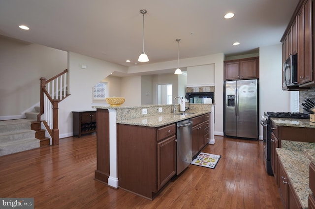 400 Blue Flax Pl, Gaithersburg, MD 20878 - kitchen with stainless steel appliances, an island with sink, dark wood-style floors, decorative light fixtures, and recessed lighting