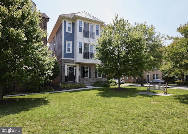 400 Blue Flax Pl, Gaithersburg, MD 20878 - view of front of house with a standing seam roof, a front yard, brick siding, and a metal roof