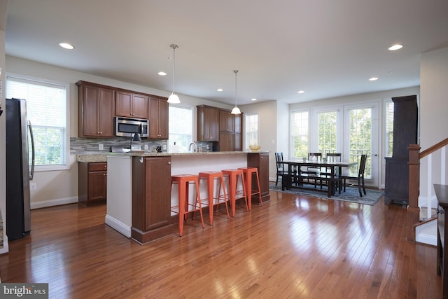 400 Blue Flax Pl, Gaithersburg, MD 20878 - kitchen featuring appliances with stainless steel finishes, healthy amount of natural light, hardwood / wood-style flooring, and recessed lighting