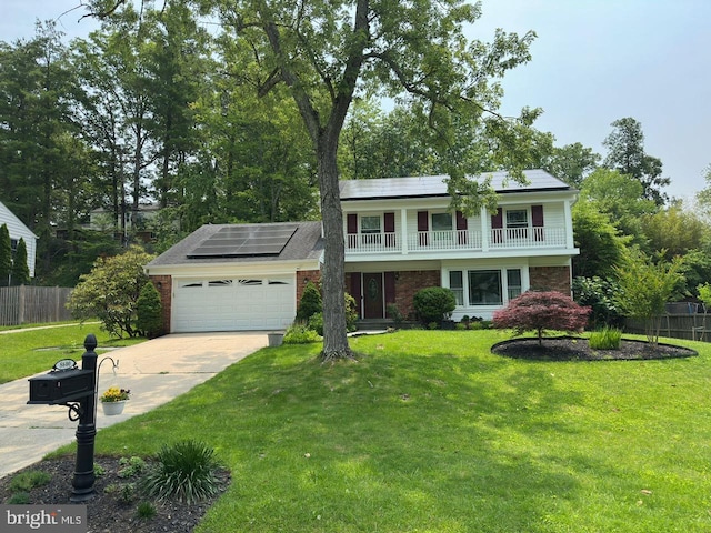 8600 Fox Run, Potomac, MD 20854 - view of front of home with a garage, concrete driveway, solar panels, brick siding, and a balcony