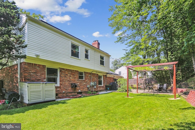 8600 Fox Run, Potomac, MD 20854 - back of house featuring a chimney, a patio area, and brick siding