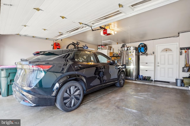 8600 Fox Run, Potomac, MD 20854 - garage with a garage door opener and freestanding refrigerator