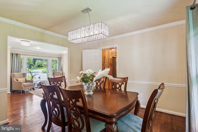 8600 Fox Run, Potomac, MD 20854 - dining area featuring wood finished floors, crown molding, and a chandelier