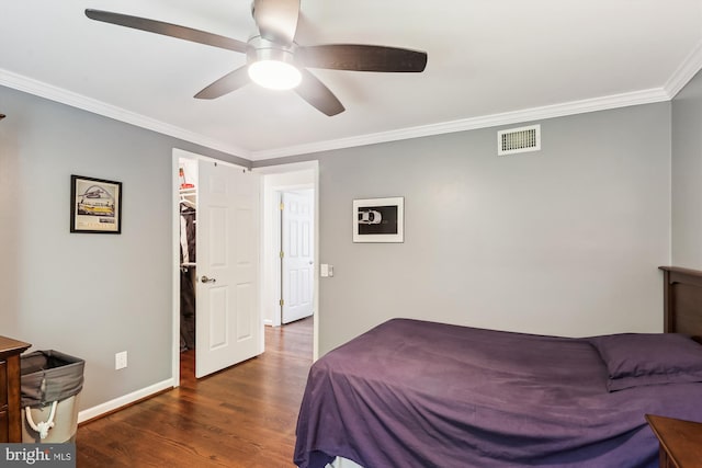 8600 Fox Run, Potomac, MD 20854 - bedroom with wood finished floors, crown molding, a ceiling fan, and a spacious closet