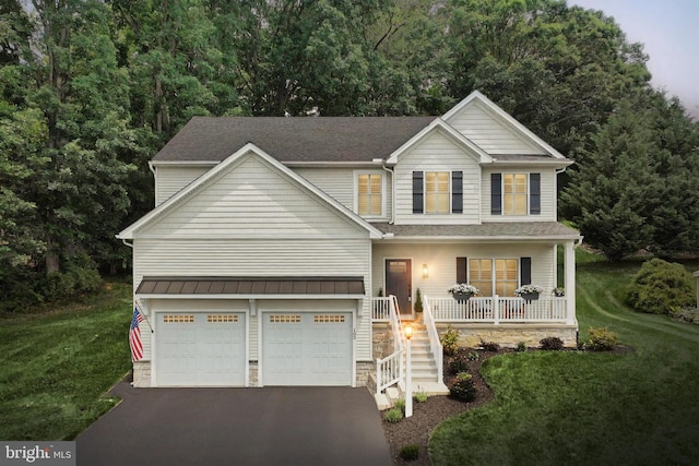105 Fading Way, York, PA 17406 - traditional-style home featuring covered porch, driveway, a front yard, and a garage