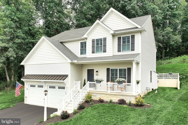 105 Fading Way, York, PA 17406 - view of front of property with a porch, driveway, a front yard, roof with shingles, and view of wooded area