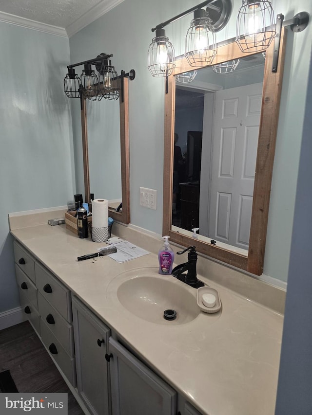 2800 Wakefield St, Colonial Beach, VA 22443 - bathroom with vanity, crown molding, and wood finished floors