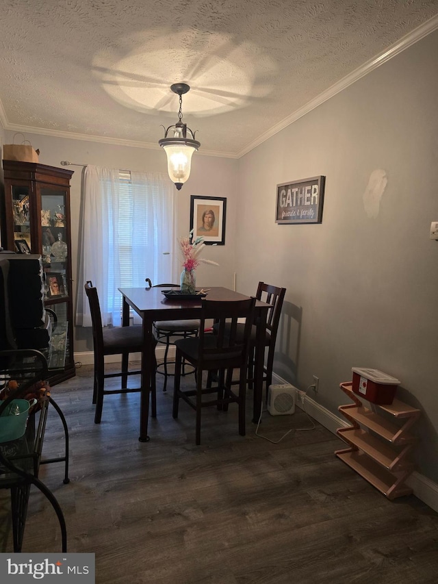 2800 Wakefield St, Colonial Beach, VA 22443 - dining area with a textured ceiling, crown molding, dark wood-style floors, and baseboards
