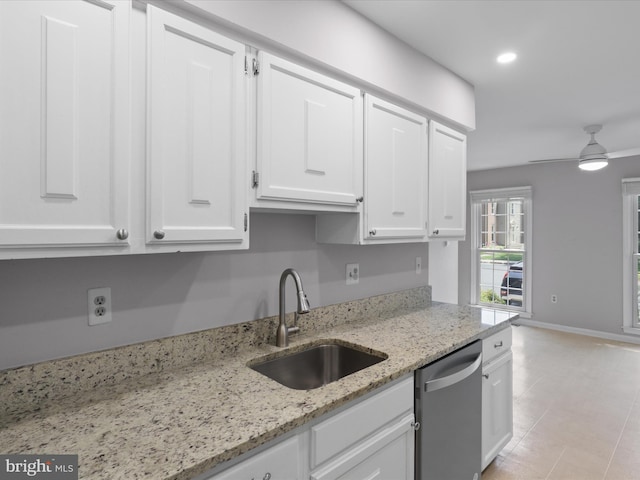 9664 Masterworks Dr, Vienna, VA 22181 - kitchen featuring stainless steel dishwasher, white cabinets, light stone countertops, ceiling fan, and light tile patterned flooring
