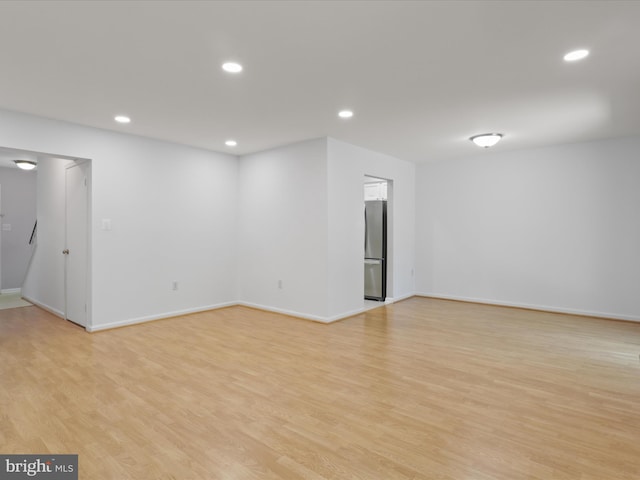 9664 Masterworks Dr, Vienna, VA 22181 - empty room featuring light wood-style flooring and recessed lighting