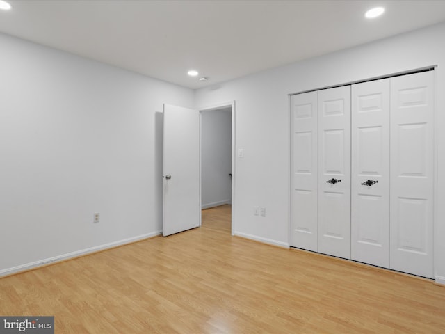 9664 Masterworks Dr, Vienna, VA 22181 - unfurnished bedroom with recessed lighting, light wood-type flooring, and a closet