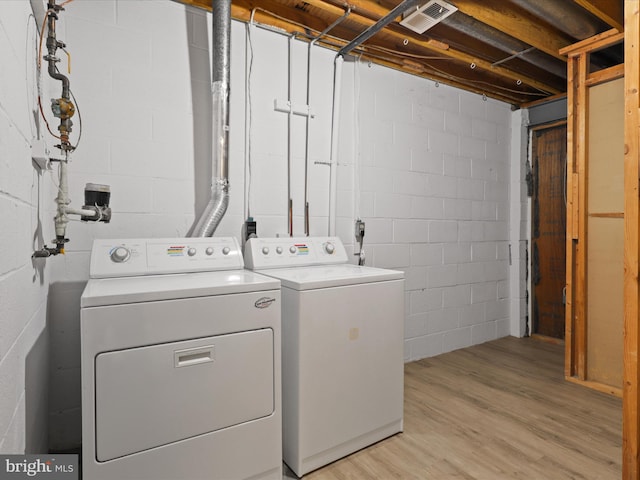 9664 Masterworks Dr, Vienna, VA 22181 - laundry area featuring washing machine and dryer and light wood finished floors