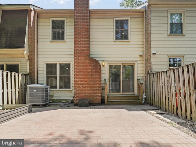 9664 Masterworks Dr, Vienna, VA 22181 - rear view of property with a fenced backyard, a patio, and a chimney