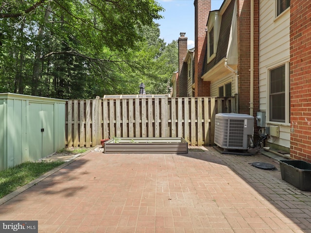 9664 Masterworks Dr, Vienna, VA 22181 - view of patio with a shed