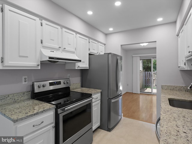 9664 Masterworks Dr, Vienna, VA 22181 - kitchen with stainless steel appliances, under cabinet range hood, white cabinetry, recessed lighting, and light stone countertops