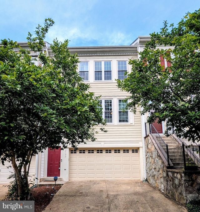 2132 Capstone Cir, Herndon, VA 20170 - view of front facade with driveway and an attached garage