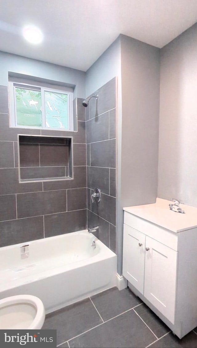 6323 Wheeler St, Philadelphia, PA 19142 - full bathroom featuring tile patterned floors, toilet, shower / washtub combination, and vanity